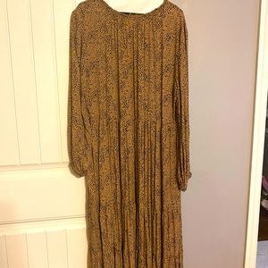 Brown & black spotted midi dress. Ruffle neckline and clasp closure in back.